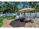 Serene backyard featuring a patio, lounge seating, a hammock, and mature trees, creating a relaxing outdoor space at 202 S Hesperides St, Tampa, FL 33609