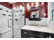 Stylish bathroom featuring a glass-enclosed shower, black and white tile, and modern fixtures at 202 S Hesperides St, Tampa, FL 33609