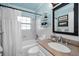 Bathroom showcasing a shower-tub combination, and a granite vanity at 202 S Hesperides St, Tampa, FL 33609