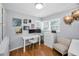 Bedroom featuring a white desk, hardwood floors, and neutral colored walls at 202 S Hesperides St, Tampa, FL 33609