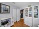Bedroom featuring hardwood floors, storage shelves, and natural light at 202 S Hesperides St, Tampa, FL 33609