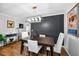 Stylish dining area with a modern chandelier and view of living space at 202 S Hesperides St, Tampa, FL 33609