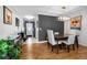 Inviting dining room features a modern chandelier and dark accent wall at 202 S Hesperides St, Tampa, FL 33609