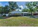 Charming brick home with a landscaped yard and fencing at 202 S Hesperides St, Tampa, FL 33609