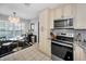 Well-designed kitchen featuring granite countertops and modern appliances at 202 S Hesperides St, Tampa, FL 33609