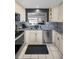 Open kitchen featuring granite countertops and stainless steel appliances at 202 S Hesperides St, Tampa, FL 33609