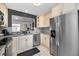 Modern kitchen featuring stainless steel appliances and granite countertops at 202 S Hesperides St, Tampa, FL 33609