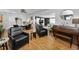 Expansive living room featuring hardwood floors, an open floor plan, and abundant natural light at 202 S Hesperides St, Tampa, FL 33609