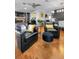 Inviting open-concept living area featuring wood floors, stylish furnishings, and a seamless flow at 202 S Hesperides St, Tampa, FL 33609