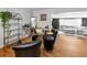 Bright living room featuring an open layout, hardwood floors, a stylish bar, and comfortable seating at 202 S Hesperides St, Tampa, FL 33609