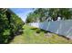 Long backyard lawn along a privacy fence and garden, with ample space at 2213 Fluorshire Dr, Brandon, FL 33511