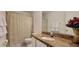 Bathroom with granite counter, decorative shower curtain, and white towels at 2213 Fluorshire Dr, Brandon, FL 33511