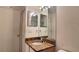 Bathroom featuring a vanity with a granite countertop and a large, framed mirror at 2213 Fluorshire Dr, Brandon, FL 33511