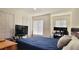 Inviting bedroom featuring a large bed, a window with blinds, and ample closet space at 2213 Fluorshire Dr, Brandon, FL 33511