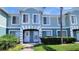 Charming two-story townhome featuring a well-maintained lawn and a quaint front entrance at 2213 Fluorshire Dr, Brandon, FL 33511