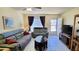 Cozy living room with sofas, tile floors, ceiling fan, and natural light at 2213 Fluorshire Dr, Brandon, FL 33511