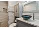 Modern bathroom featuring a glass bowl sink, wave tile accents, and sleek fixtures at 2700 Bayshore Blvd # 522, Dunedin, FL 34698
