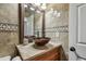 Bathroom with a vessel sink, vanity, and decorative mirror at 2700 Bayshore Blvd # 522, Dunedin, FL 34698