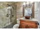 Elegant bathroom featuring a glass-enclosed shower, a modern vanity, and stylish tile accents at 2700 Bayshore Blvd # 522, Dunedin, FL 34698