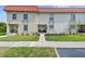Charming condo building with a red tile roof and well-maintained landscaping in a desirable neighborhood at 2700 Bayshore Blvd # 522, Dunedin, FL 34698