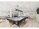 Spacious community game room with a pool table, ping pong table, fitness equipment and tables for games at 2700 Bayshore Blvd # 522, Dunedin, FL 34698