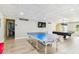 Community recreation area with a ping pong table, tv, billiard table, and lots of open space at 2700 Bayshore Blvd # 522, Dunedin, FL 34698