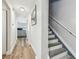 Hallway with hardwood floors leading to a brightly lit living area at 2700 Bayshore Blvd # 522, Dunedin, FL 34698