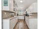 Bright kitchen featuring updated cabinets, stylish backsplash, and stainless steel appliances, creating a welcoming space at 2700 Bayshore Blvd # 522, Dunedin, FL 34698
