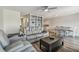 Living room with wood floors, seating, table, and eat-in kitchen at 2700 Bayshore Blvd # 522, Dunedin, FL 34698
