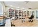 Bright reading room with ample bookshelves, table space, and chairs for residents to relax and enjoy books and games at 2700 Bayshore Blvd # 522, Dunedin, FL 34698