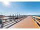 Long wooden dock extending into the ocean with clear skies above at 2700 Bayshore Blvd # 522, Dunedin, FL 34698