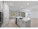 Open-concept kitchen featuring a large island, and seamless access to the living area at 29156 Coral Harbour Dr, Englewood, FL 34223