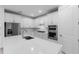 Well-appointed kitchen featuring a center island, stainless steel appliances, and modern cabinetry at 29156 Coral Harbour Dr, Englewood, FL 34223