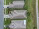 Aerial view of the rooftops of a neighborhood highlighting surrounding green space and nearby streets at 3009 Banyan Hill Ln, Land O Lakes, FL 34639