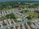 An aerial view showcasing the neighborhood, community layout, and nearby green spaces at 3009 Banyan Hill Ln, Land O Lakes, FL 34639