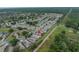 Aerial view of a neighborhood highlighting the residential area, adjacent green space and surroundings at 3009 Banyan Hill Ln, Land O Lakes, FL 34639