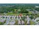 Aerial view of home backing up to a utility easement in a lush neighborhood with mature trees and landscaping at 3009 Banyan Hill Ln, Land O Lakes, FL 34639