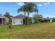 Lush backyard with palm trees offers privacy and a tropical feel at 3009 Banyan Hill Ln, Land O Lakes, FL 34639