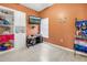 Cozy bedroom with warm color scheme and built in bookshelf at 3009 Banyan Hill Ln, Land O Lakes, FL 34639