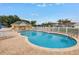 Beautiful community pool with ample lounge seating and a changing house at 3009 Banyan Hill Ln, Land O Lakes, FL 34639