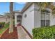 Charming single story home with welcoming walkway, brick accents and lush landscaping at 3009 Banyan Hill Ln, Land O Lakes, FL 34639