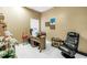 Bright office space with tile flooring, a desk, and a comfortable gaming chair, ideal for work or relaxation at 3009 Banyan Hill Ln, Land O Lakes, FL 34639