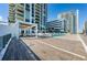 Outdoor deck and pool area with lounge seating and a pergola, offering scenic views at 301 1St S St # 3004, St Petersburg, FL 33701