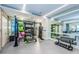 Modern fitness center with a variety of equipment, mirrors, and natural light for a complete workout experience at 301 1St S St # 3004, St Petersburg, FL 33701