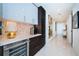 Bright hallway featuring sleek tile flooring, elegant lighting, and stylish decor elements at 301 1St S St # 3004, St Petersburg, FL 33701
