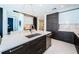 Modern kitchen features a large island, stainless steel appliances, and dark wood and white cabinetry at 301 1St S St # 3004, St Petersburg, FL 33701