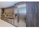 Modern kitchen features wood grain cabinets and stainless steel appliances at 301 1St S St # 3004, St Petersburg, FL 33701