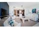 Open-concept living room with stylish decor, sleek flooring, and natural light at 301 1St S St # 3004, St Petersburg, FL 33701