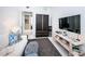 Inviting living room with dark wood accents and an entertainment center with decor at 301 1St S St # 3004, St Petersburg, FL 33701