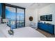 Bright main bedroom with balcony access, light wood floors, and scenic city view at 301 1St S St # 3004, St Petersburg, FL 33701